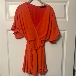 Vibrant Orange Wrap Jumpsuit